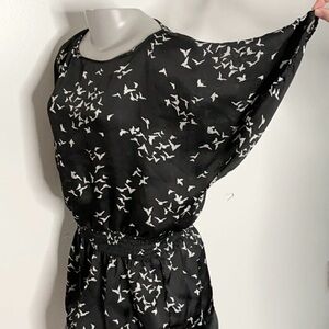 Black blouse with elastic waist band & bat sleeves & flocks of white bird BX26